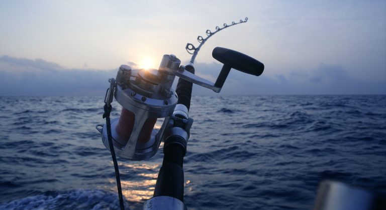 Big game boat fishing in deep sea on boat